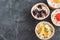 Gourmet food Snack Tartlet Creamy goat cheese Dried Fruit Appetizer Dark concrete background Copy space French cuisine