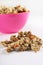 Gourmet granola in pink bowl vertical