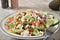 Gourmet Greek salad with olives, feta cheese and red bell pepper bits