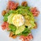 Gourmet green salad with prosciutto and ricotta white cheese