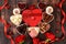 Gourmet heart shaped chocolate candies, sugar cranberry, meringue and rose flowers, food for Valentine\\\'s Day