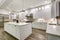 Gourmet kitchen features white cabinetry