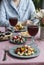 A gourmet lunch for two: salad, canapes, rye bread sandwiches, boiled eggs and wine