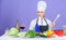 Gourmet main dish recipes. Cooking is her hobby. Cooking healthy food. Girl in hat and apron. Woman chef cooking healthy