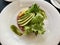 Gourmet meal - Tuna tartar and Avocado slices with green Asian sauce