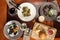 Gourmet meals assorted set burger ravioli noodles on wooden table Buffet at restaurant