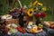 gourmet picnic for two, with basket of fresh fruits and cheeses, wine glasses, and vase of flowers