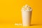 Gourmet Popcorn tasty fast food street food for take away on yellow background