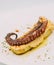 gourmet portion of octopus tentacle on baked potatoes