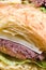 Gourmet roast beef sandwich on croissant