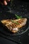Gourmet t-bone steak or aged wagyu porterhouse grilled beef steak in American meat restaurant. Chef sprinkles with seasoning in a