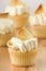 Gourmet Vanilla Cupcakes With Buttercream Frosting And White Chocolate Garnish