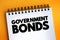 Government Bonds text on notepad, concept background