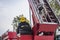 Government-organized fire drills, fire fighters operating high-altitude ladders