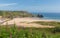 The Gower South Wales Three Cliffs Bay with pink flowers near to Oxwich