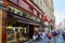 Goyard luxury store in Paris with window and wooden facade and people waiting in queue