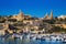 Gozo, Malta - The harbour of Mgarr with view of church Our Lady of Lourdes on top