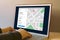 GPS map navigation app on laptop screen. Location tracker concept