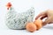 Grab Egg from White Ceramic Hen