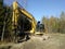 Grab excavator in forest