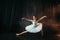 Grace of ballerina in motion on theatrical stage