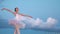 Graceful ballerina dance ballet background clouds. Elegant flexible girl dancer.