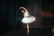 Graceful ballerina dancing on theatrical stage