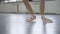 Graceful ballerina legs in pointe shoes. girl dancing in the old dance hall 4K