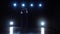 Graceful ballet dancer shows modern ballet over spotlights. Slow motion.