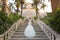 Graceful bride climbs the stone stairs in a wedding dress