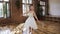 Graceful charming ballerina in white tutu perform classical dance at ballet school. Young slim ballerina in white dress