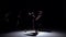 Graceful contemporary dance of four dancers on black, shadow, slow motion