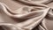 Graceful Curves: A Close-up Of Taupe Satin Fabric