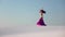 Graceful dancer against the sky dancing belly dance in a brilliant outfit. Slow motion
