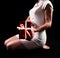 Graceful Elegance: Beautiful Woman Holding a Gift in White Woolen Dress