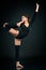 Graceful girl gymnast standing stretching in One leg in splits a