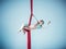 Graceful gymnast performing aerial exercise