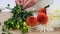 Graceful hands arranging flowers on table against white background