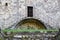 Graceful and light wrought iron railing of a large and historic stone house in San Romano in Garfagnana.