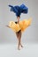 Graceful woman dancing with colorful cloth in studio