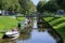 Gracht or canal with leisure boats in Friedrichstadt, the beautiful town and travel destination in northern Germany founded by