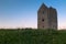 The grade II listed Dovecote Tower at Bruton in Somerset shot at sunset