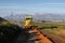 A grader in the process of grading a dirt road