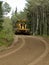 Grader resurfacing narrow rural road