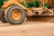 Grader Road Construction Grader industrial machine on construction of new roads. the blade of a motor grader in the process of lev