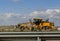 Grader yellow, industrial machine for the construction of new roads