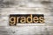 Grades Letterpress Word on Wooden Background