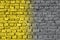 Gradient Ultimate Gray and Illuminating yellow ancient brick wall toned in trendy colors of 2021. Brick wall background