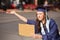 Graduate with Cardboard Sign