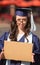 Graduate Carrying Cardboard Sign